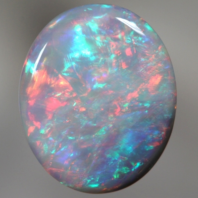 SOLID SEMI BLACK OPAL Rolling flashes of red over green and blue. SEE VIDEO